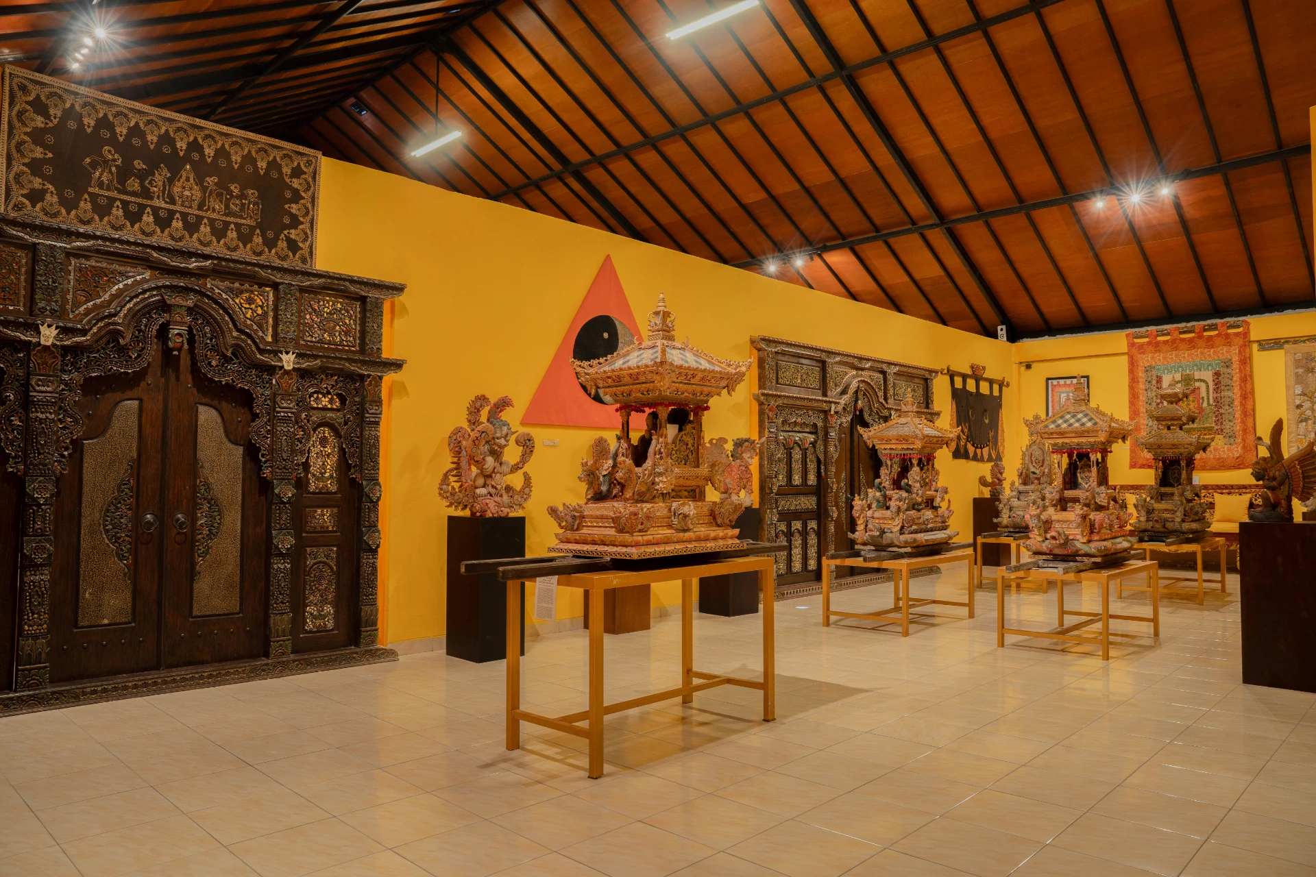 Collection of traditional Balinese textiles and ancient beaded jewelry fragments.