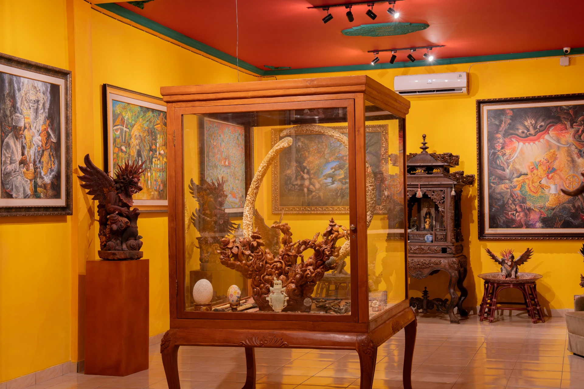 Interior of the Bale Gede Cultural Room at Museum Peter Bloch Collection featuring traditional Balinese architecture and history.
