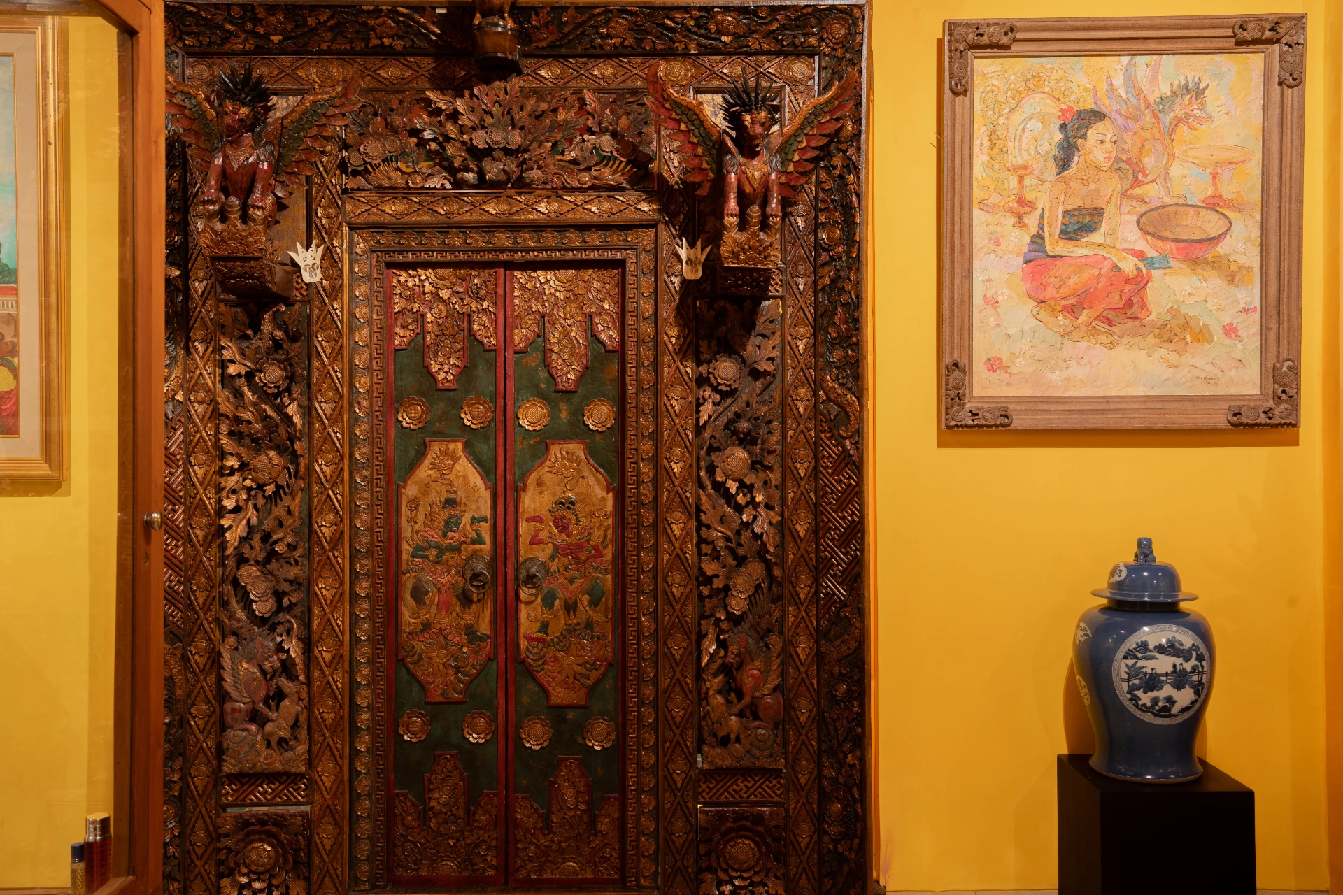 Ornate Balinese carved wooden doorway in the Bale Gede Room, Museum Peter Bloch Collection.