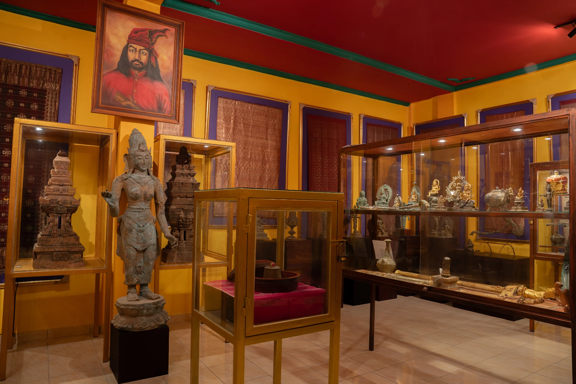 Collections of ornate bronze Hindu-Buddhist deity statues at Museum Peter Bloch Collection.
