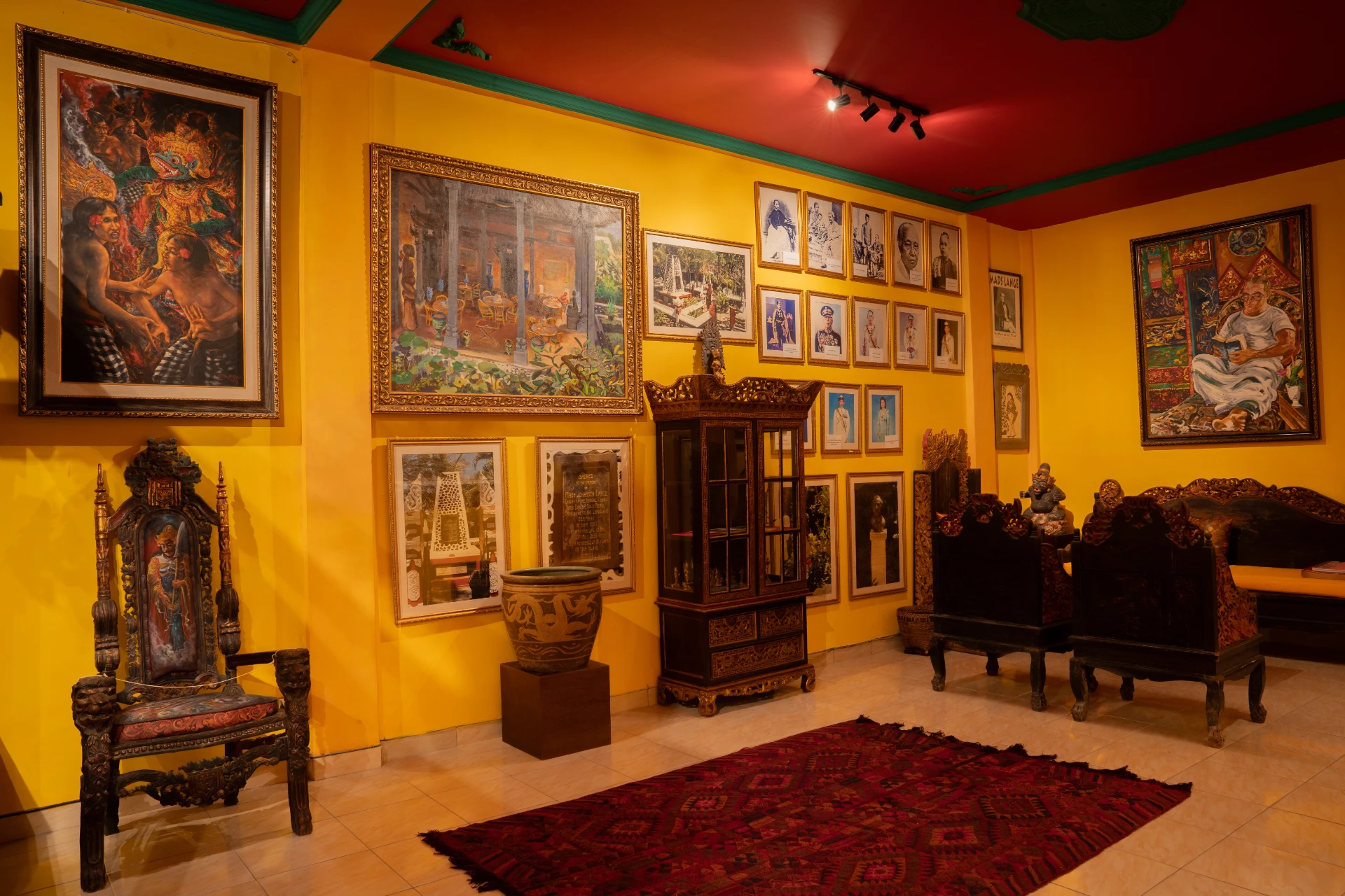 Interior paintings of the Bale Gede Room at Museum Peter Bloch Collection featuring traditional Balinese architecture and history.