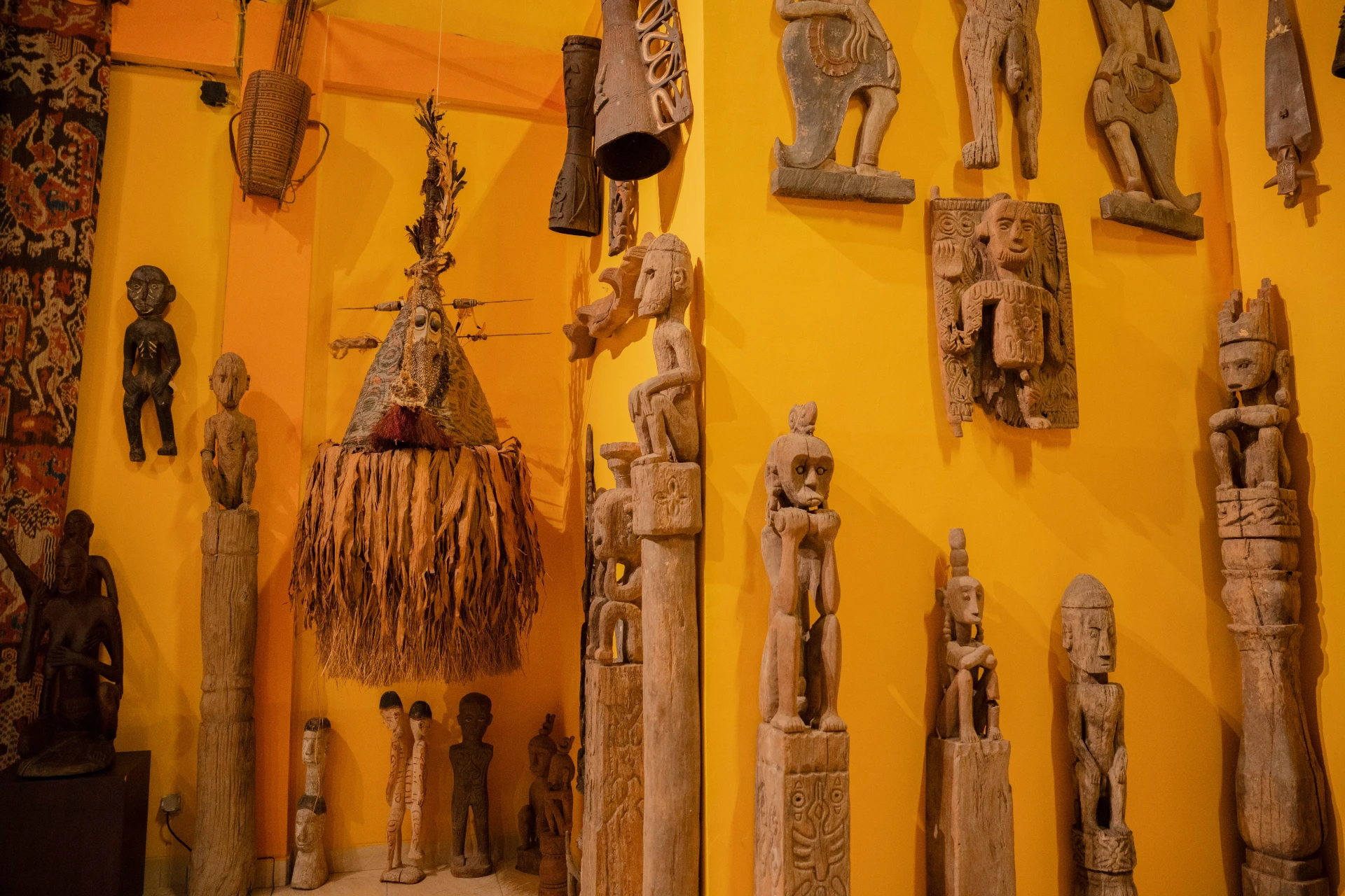 Ancient sharpened combat staves and traPapua collection in the Scary Room.
