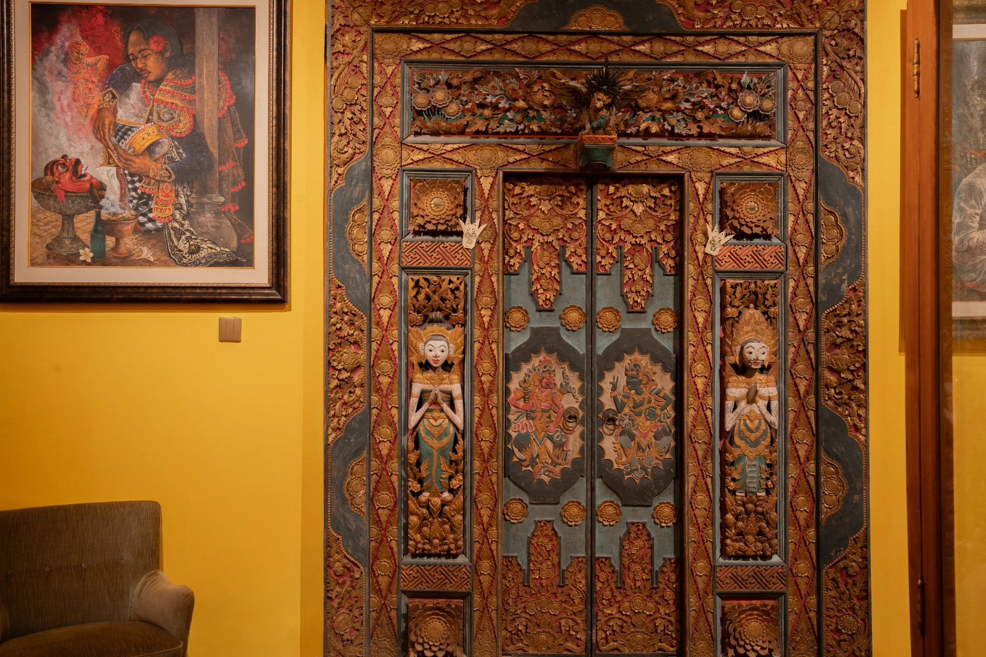 Front view Ornate Balinese carved wooden doorway in the Bale Gede Room, Museum Peter Bloch Collection.